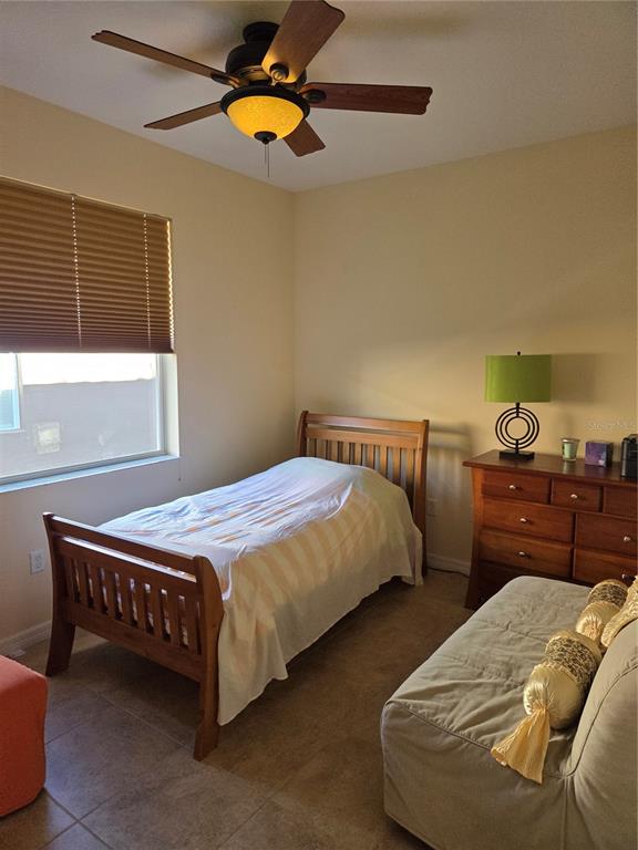 527 Safe Harbor Drive Edgewater, FL 32141 - Photo 16 of 33 a bedroom with a bed and window