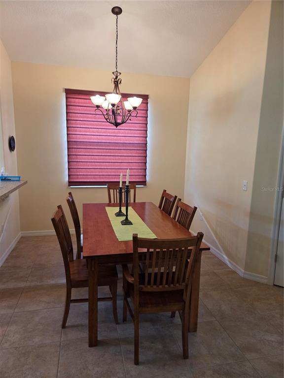 527 Safe Harbor Drive Edgewater, FL 32141 - Photo 20 of 33 a dining room with furniture and window