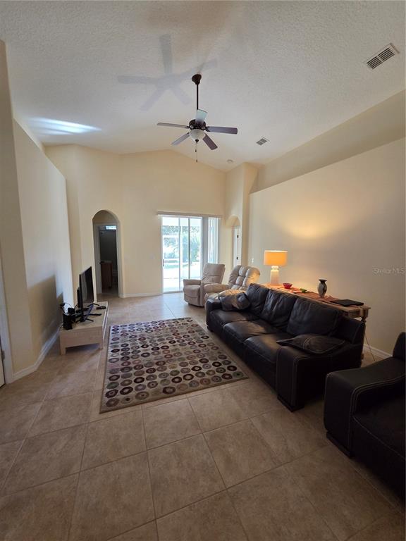 527 Safe Harbor Drive Edgewater, FL 32141 - Photo 21 of 33 a living room with a couch and a window