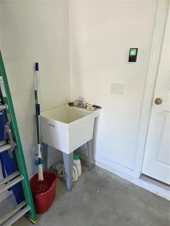 a room with furniture and a potted plant