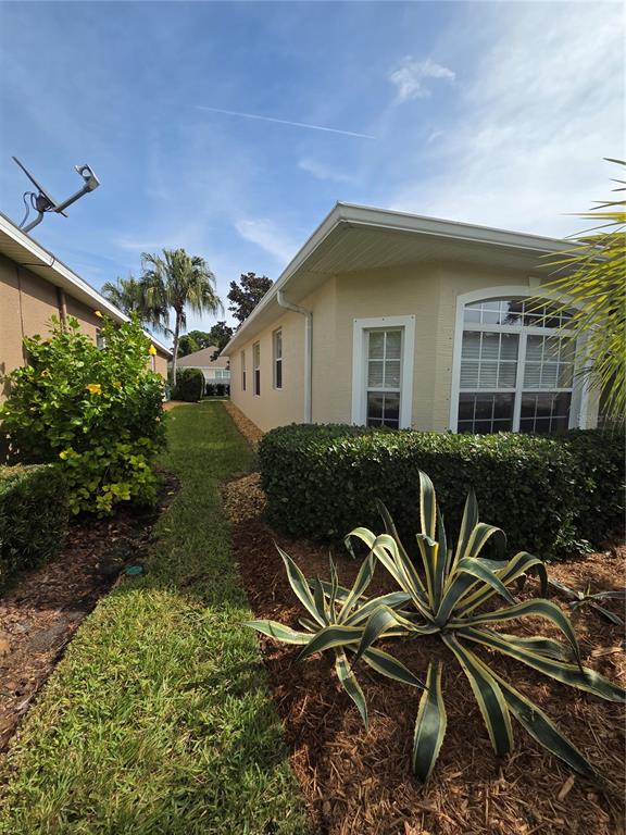 527 Safe Harbor Drive Edgewater, FL 32141 - Photo 25 of 33 a house view with a garden space