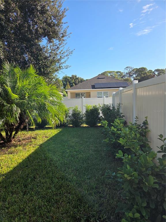527 Safe Harbor Drive Edgewater, FL 32141 - Photo 29 of 33 a view of a house with a yard and a fountain