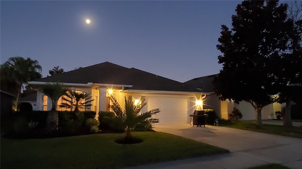 527 Safe Harbor Drive Edgewater, FL 32141 - Photo 5 of 33 a front view of a house with a yard
