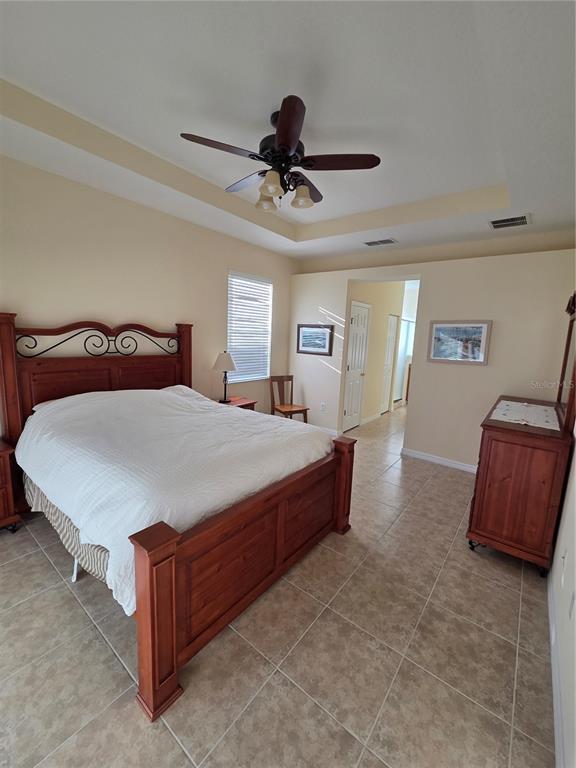 527 Safe Harbor Drive Edgewater, FL 32141 - Photo 10 of 33 a bedroom with a bed and window