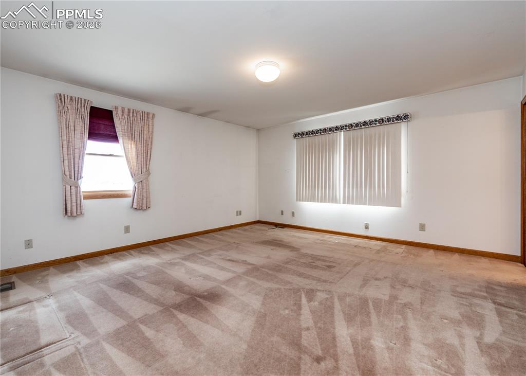 6185 Sayres Road Colorado Springs, CO 80927 - Photo 20 of 50 a view of an empty room with a window