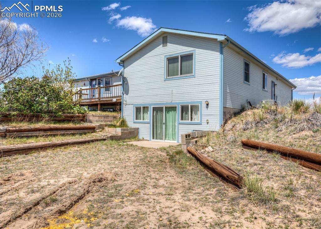 6185 Sayres Road Colorado Springs, CO 80927 - Photo 2 of 50 a view of a house with a yard and sitting area