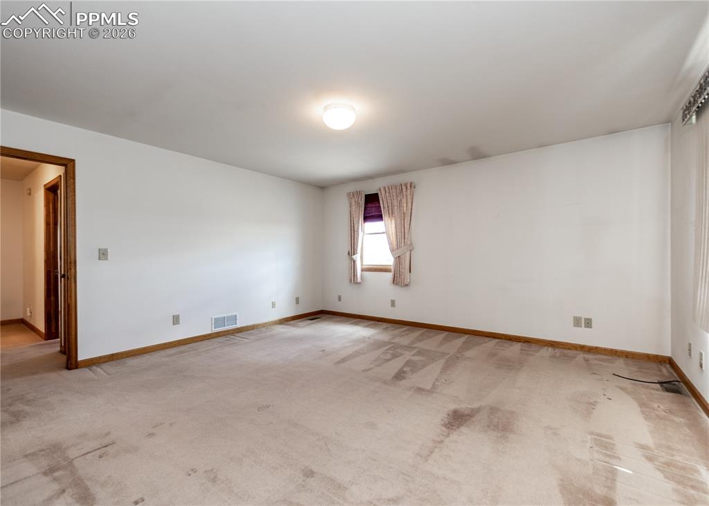 6185 Sayres Road Colorado Springs, CO 80927 - Photo 22 of 50 a view of an empty room and window