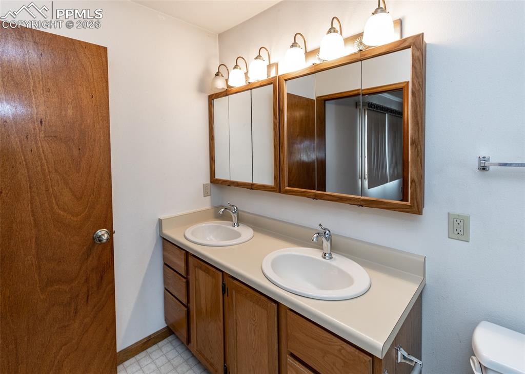 6185 Sayres Road Colorado Springs, CO 80927 - Photo 27 of 50 a bathroom with a sink and a mirror