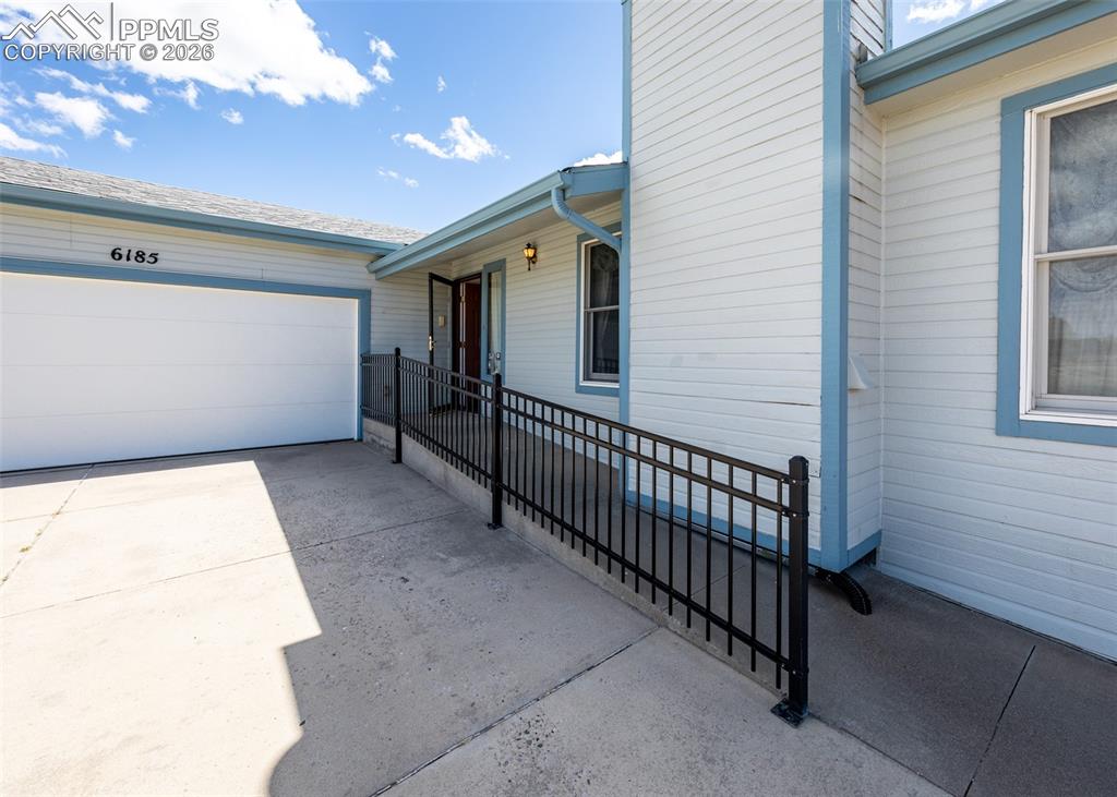 6185 Sayres Road Colorado Springs, CO 80927 - Photo 3 of 50 a view of a porch with a bench