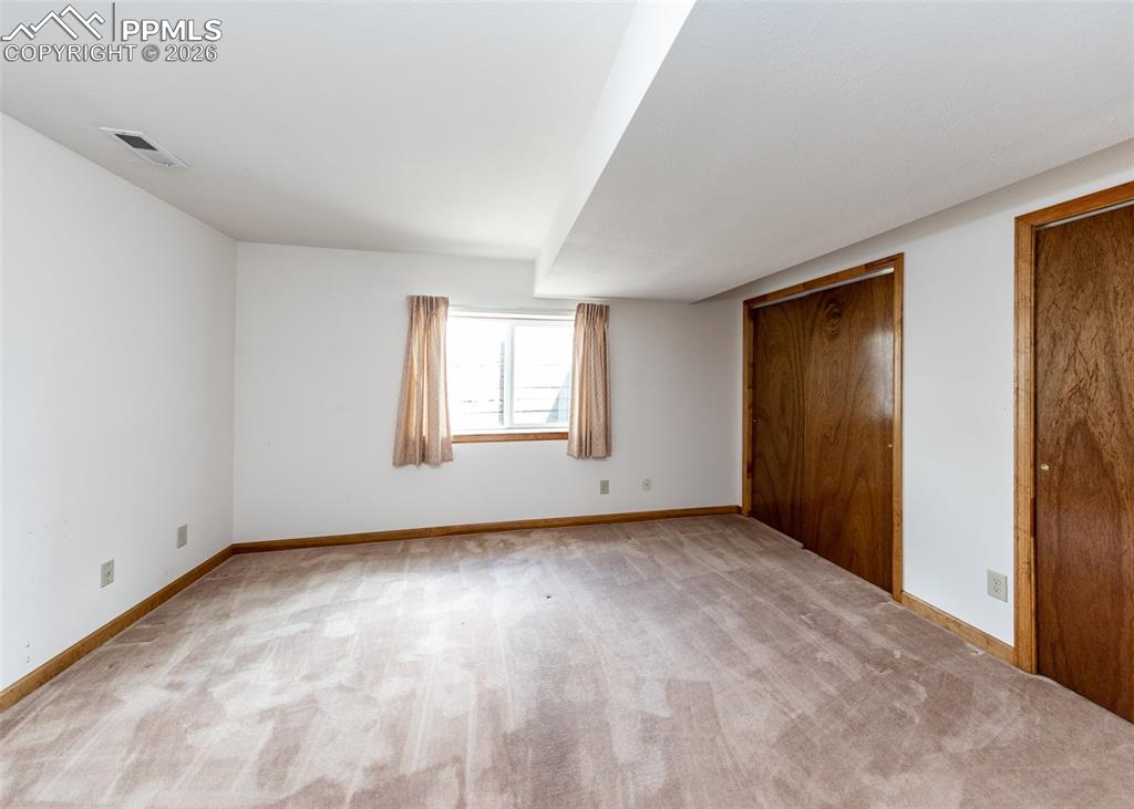 6185 Sayres Road Colorado Springs, CO 80927 - Photo 33 of 50 a view of an empty room with window