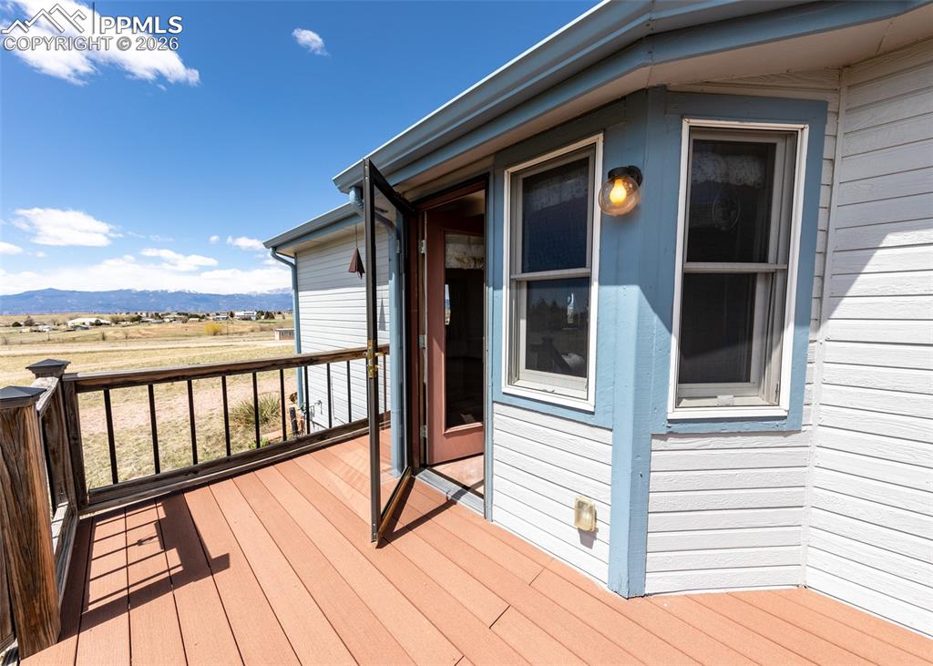6185 Sayres Road Colorado Springs, CO 80927 - Photo 37 of 50 a view of balcony with wooden floor