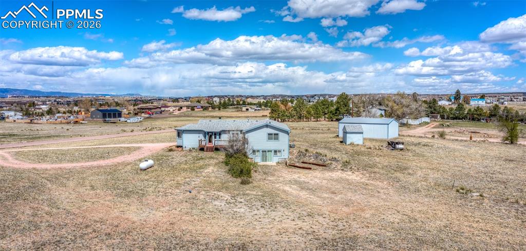 6185 Sayres Road Colorado Springs, CO 80927 - Photo 44 of 50 a view of a dry yard with wooden fence