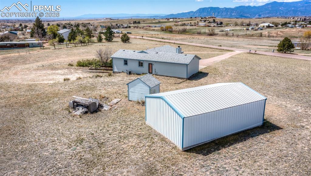 6185 Sayres Road Colorado Springs, CO 80927 - Photo 46 of 50 an aerial view of a house with a yard and lake view