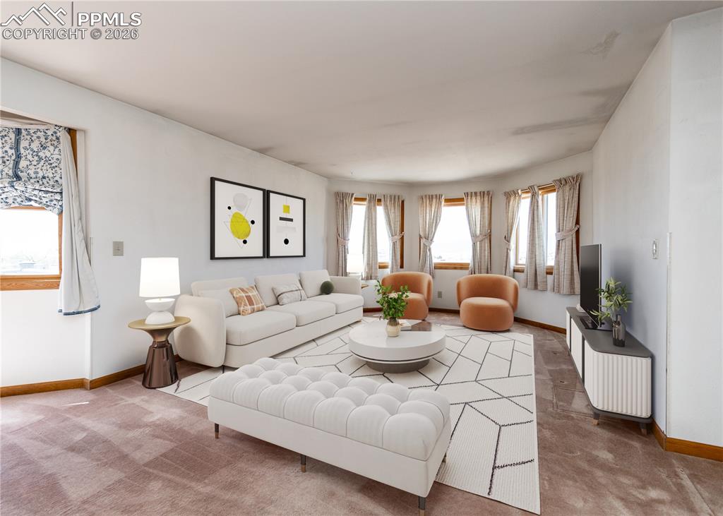 6185 Sayres Road Colorado Springs, CO 80927 - Photo 6 of 50 a living room with furniture and a large window