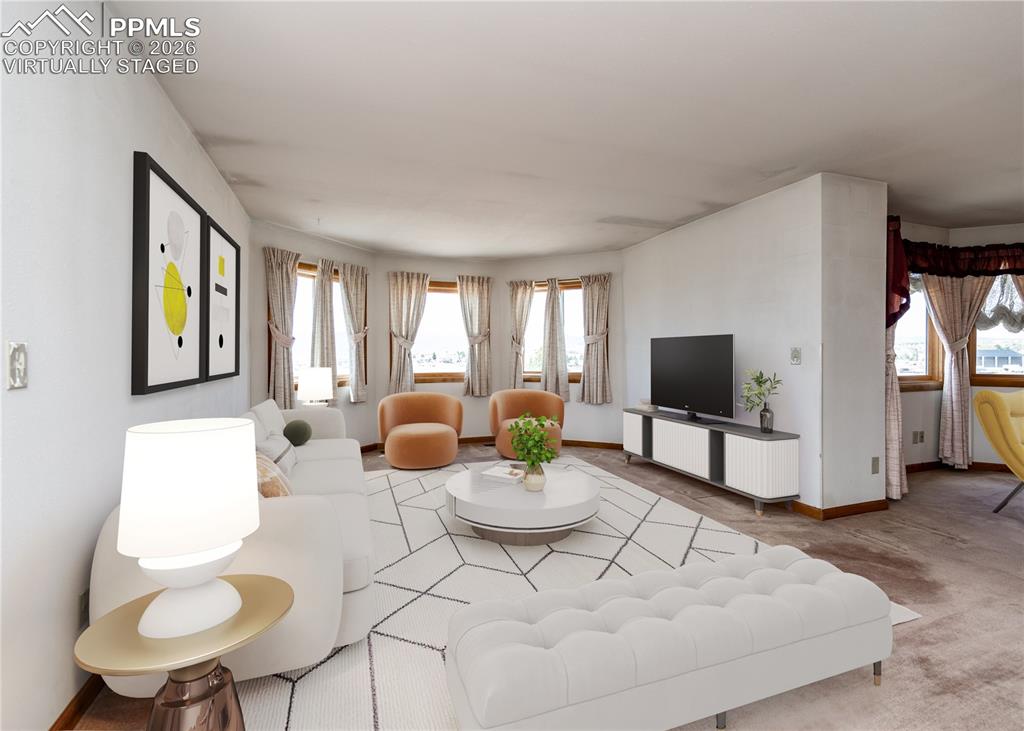 6185 Sayres Road Colorado Springs, CO 80927 - Photo 8 of 50 a living room with furniture and a flat screen tv