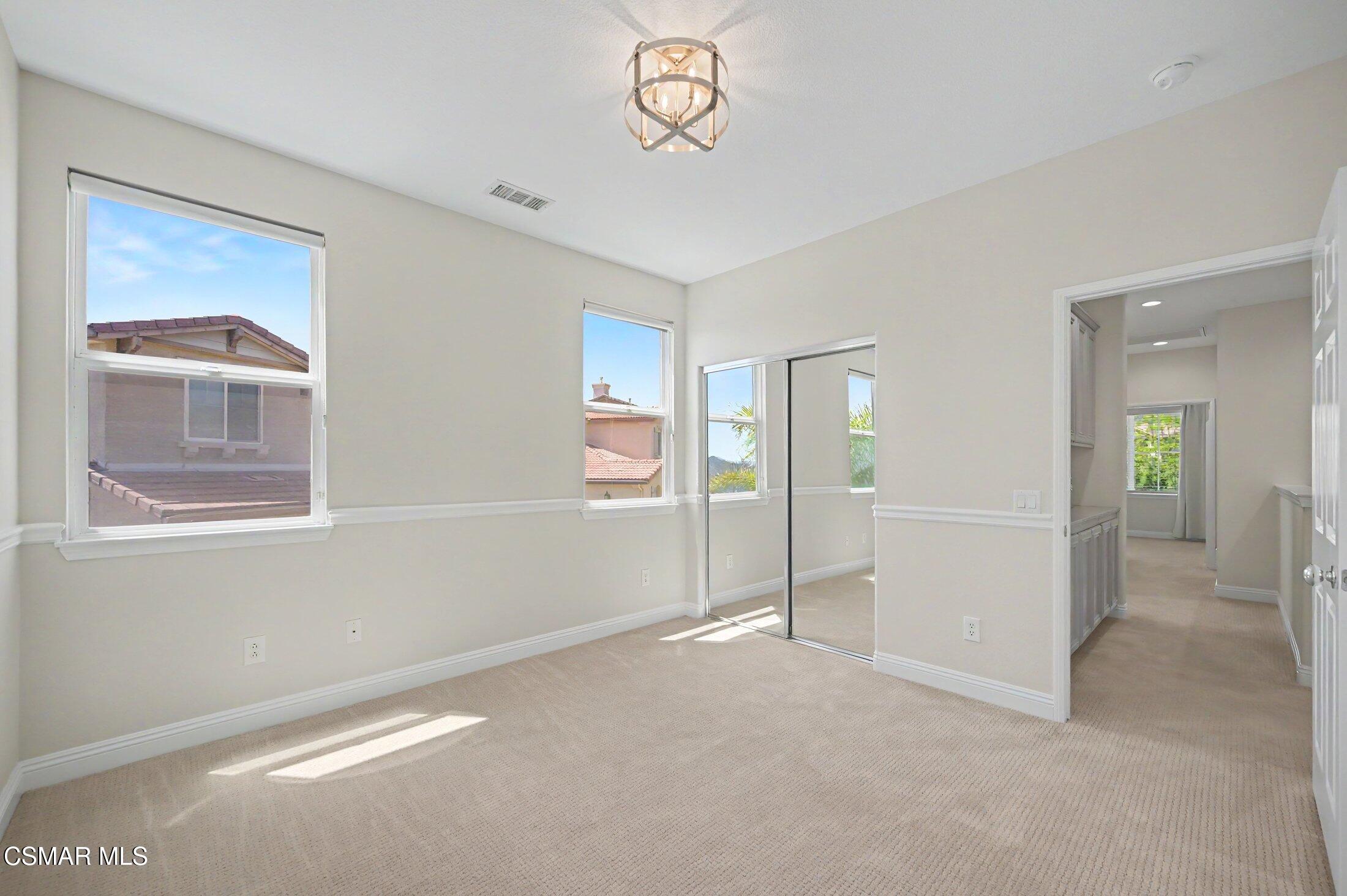 20800 Sardinia Way Porter Ranch, CA 91326 - Photo 36 of 57 a view of an empty room with a window