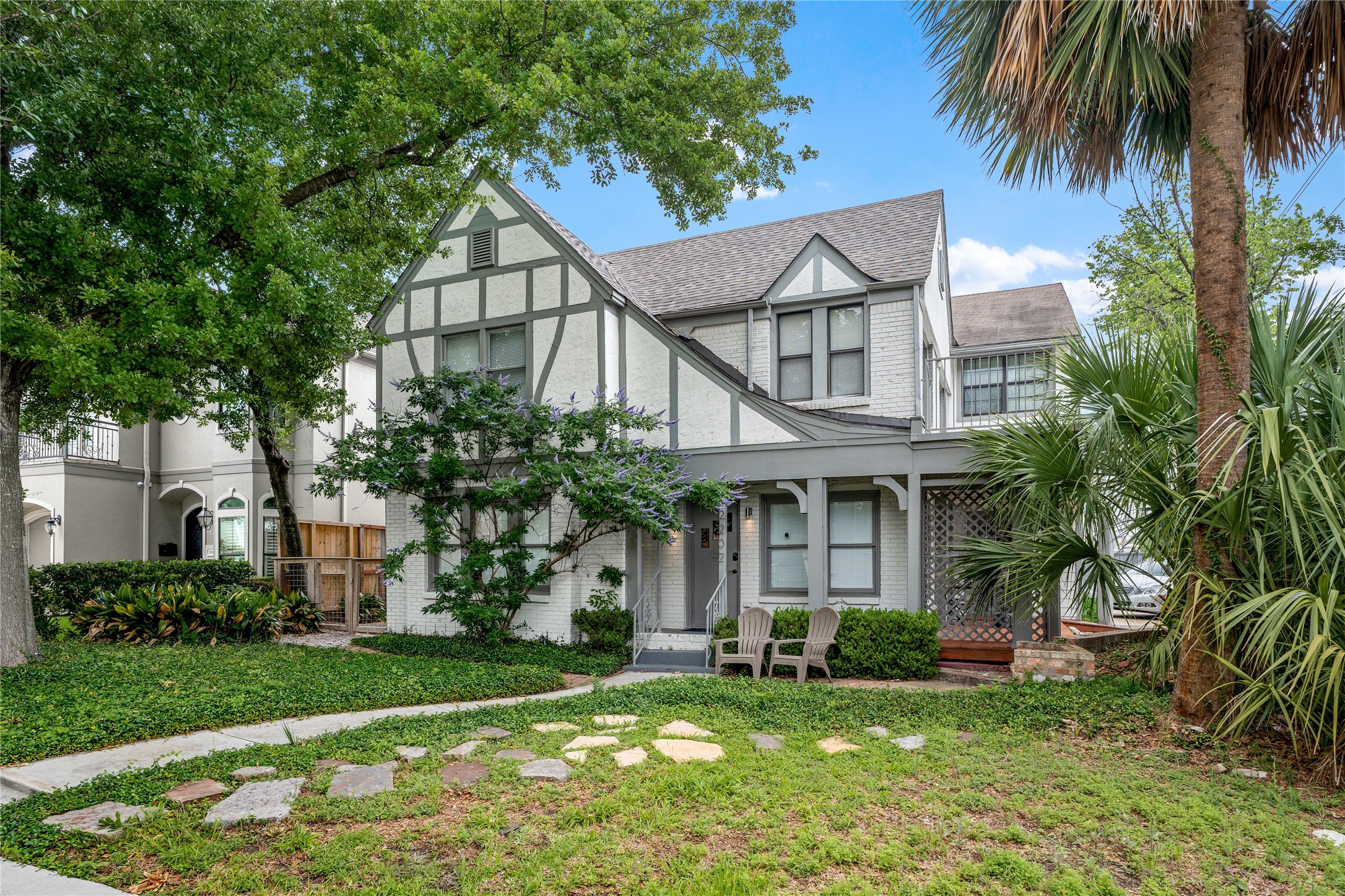a house that has a big yard and large trees