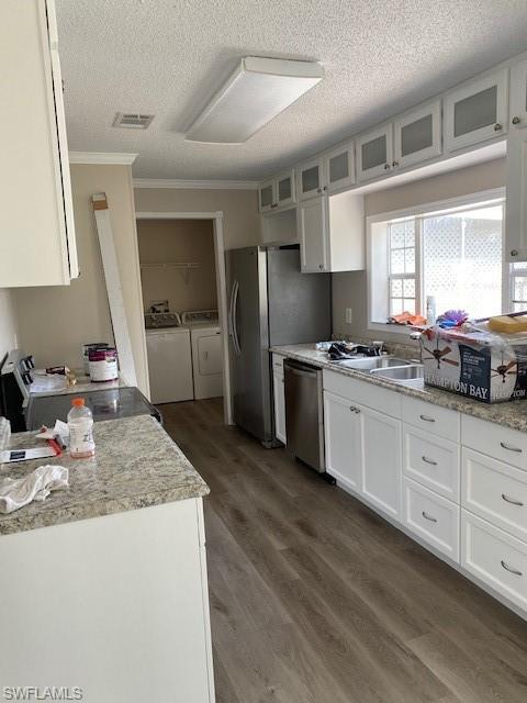158 Rookery Road Naples, FL 34114 - Photo 12 of 26 a kitchen with stainless steel appliances granite countertop a sink stove refrigerator and cabinets