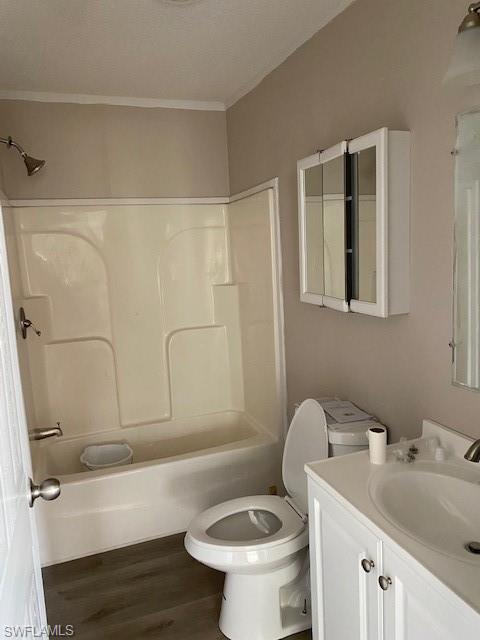 158 Rookery Road Naples, FL 34114 - Photo 25 of 26 a bathroom with a toilet sink and mirror