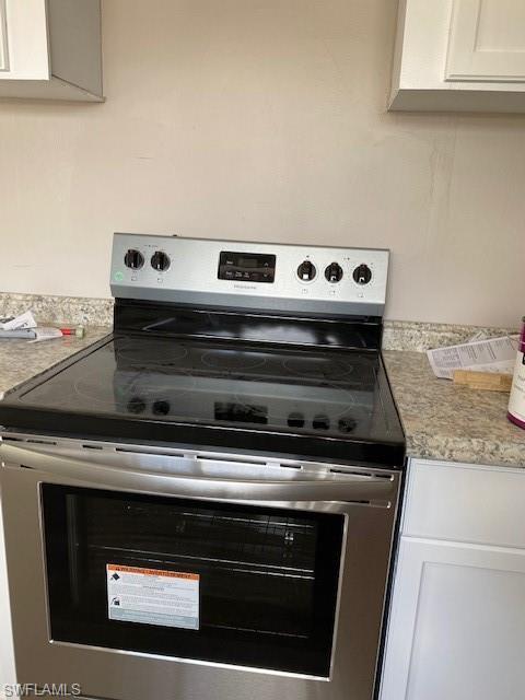 158 Rookery Road Naples, FL 34114 - Photo 8 of 26 a stove top oven sitting inside of a kitchen