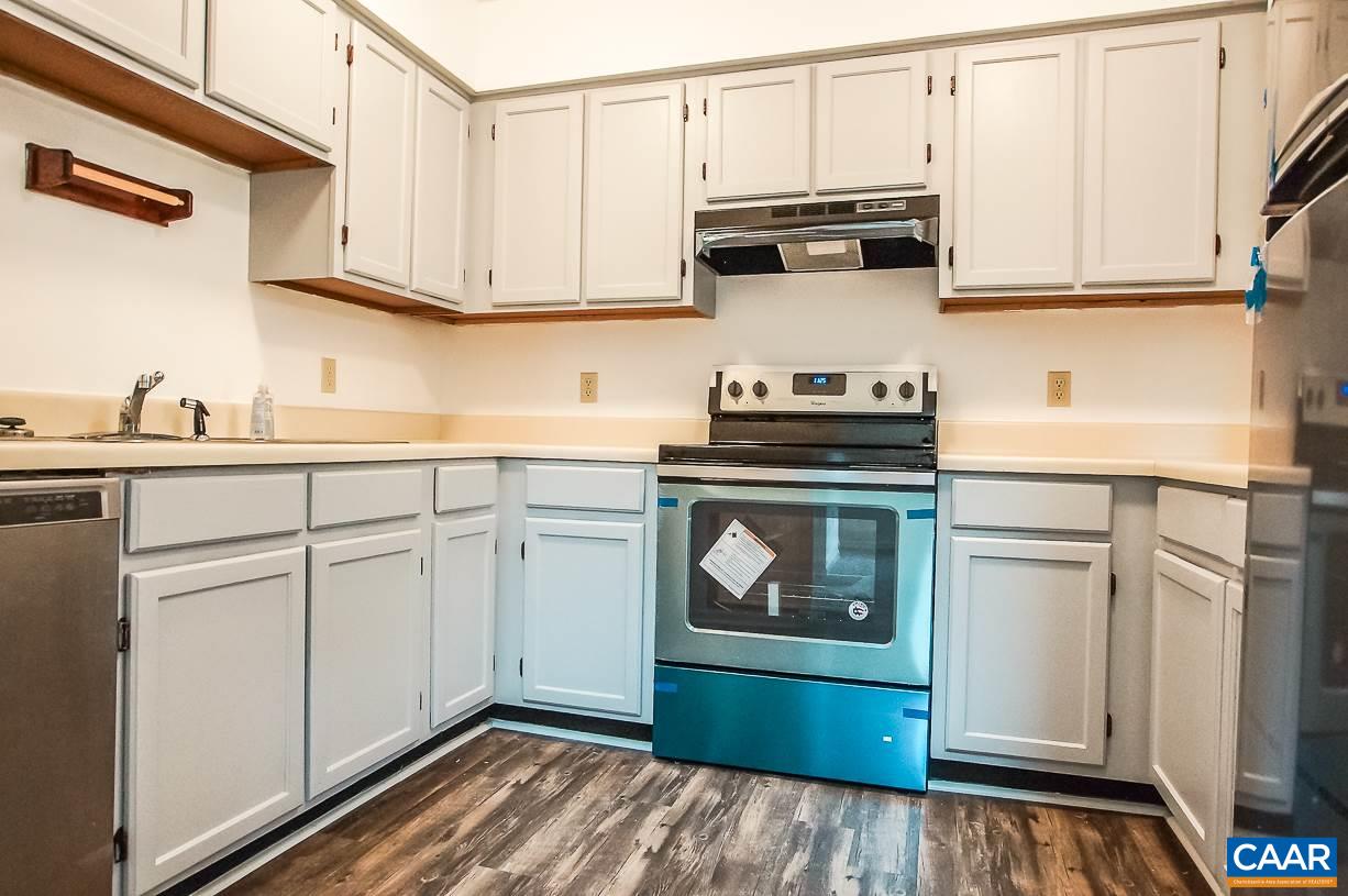 346 Westfield Road Charlottesville, VA 22901 - Photo 4 of 18 a kitchen with white cabinets and appliances