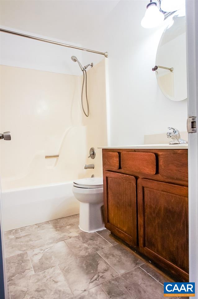 346 Westfield Road Charlottesville, VA 22901 - Photo 10 of 18 a bathroom with a sink and mirror