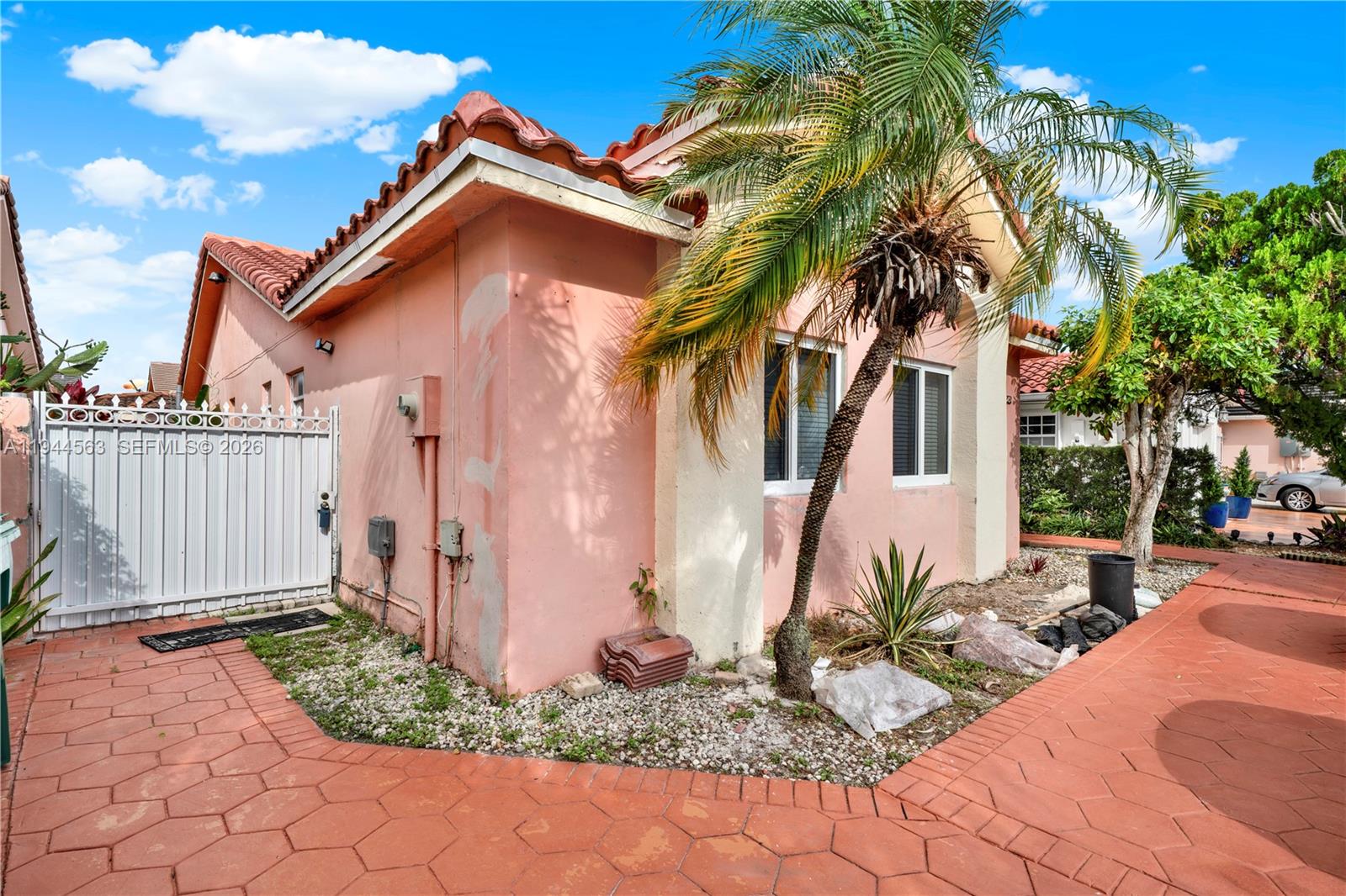 14643 Southwest 51st Street Miami, FL 33175 - Photo 1 of 23 a front view of a house with a yard