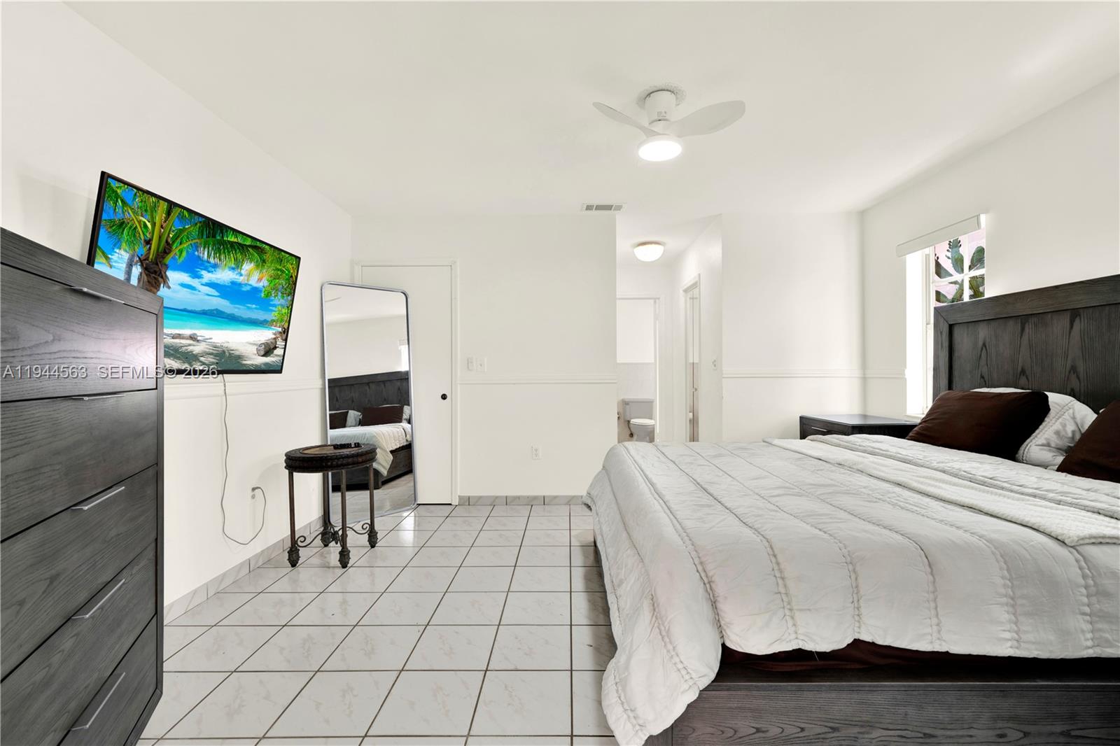 14643 Southwest 51st Street Miami, FL 33175 - Photo 15 of 23 a bed room with a bed and a television