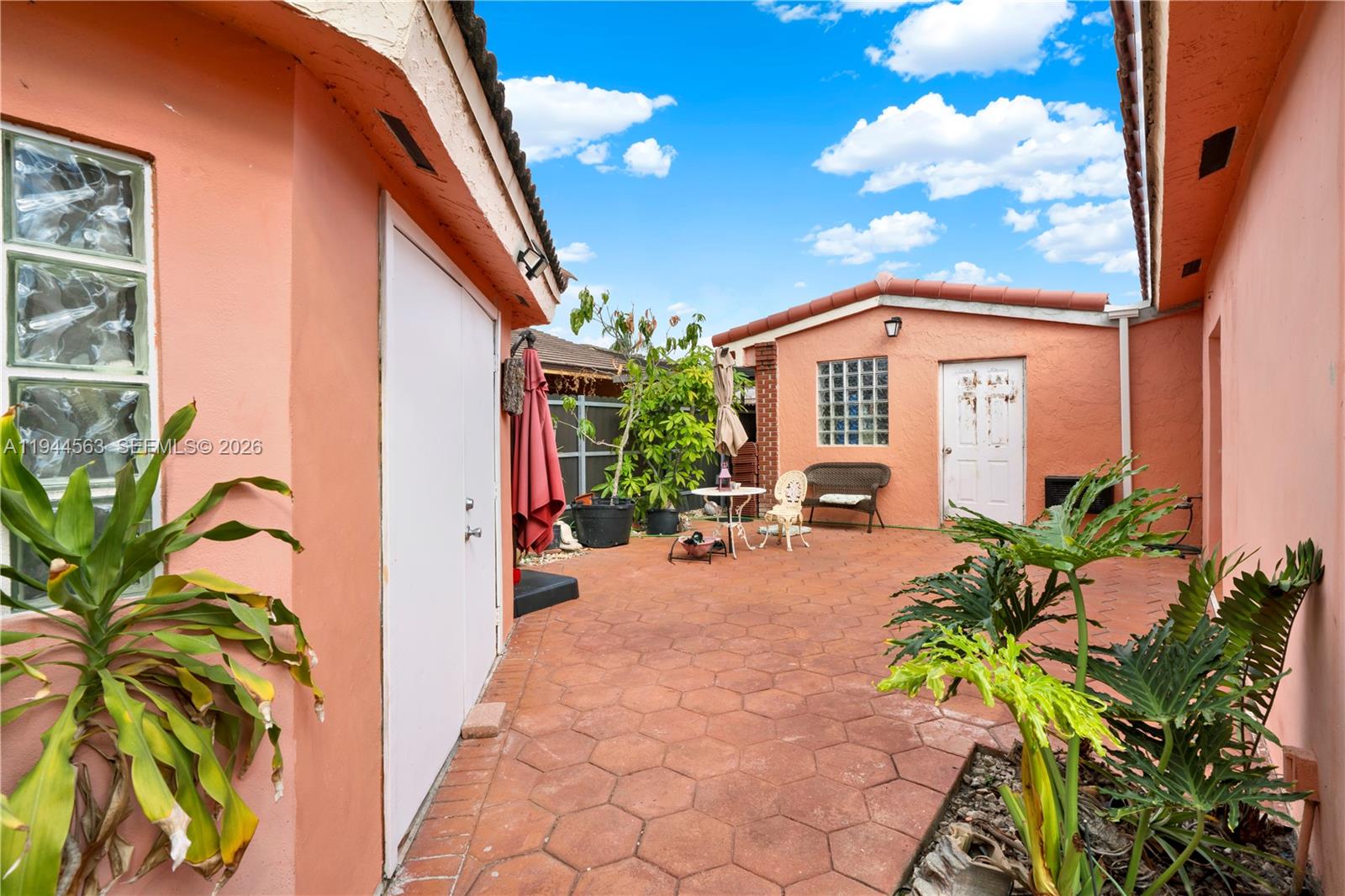14643 Southwest 51st Street Miami, FL 33175 - Photo 2 of 23 a front view of a house with a yard