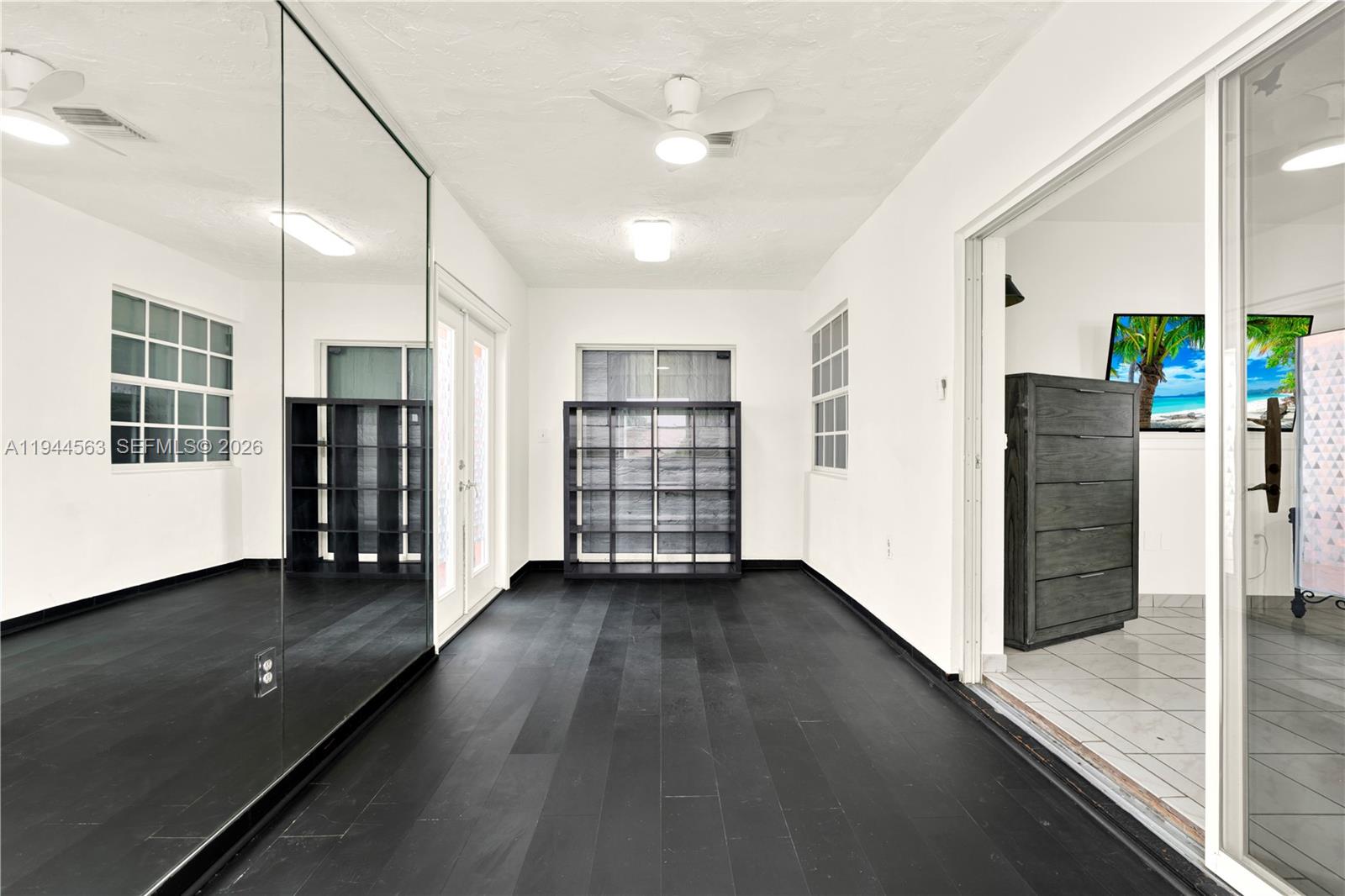 14643 Southwest 51st Street Miami, FL 33175 - Photo 7 of 23 a view of an empty room with closet and a window