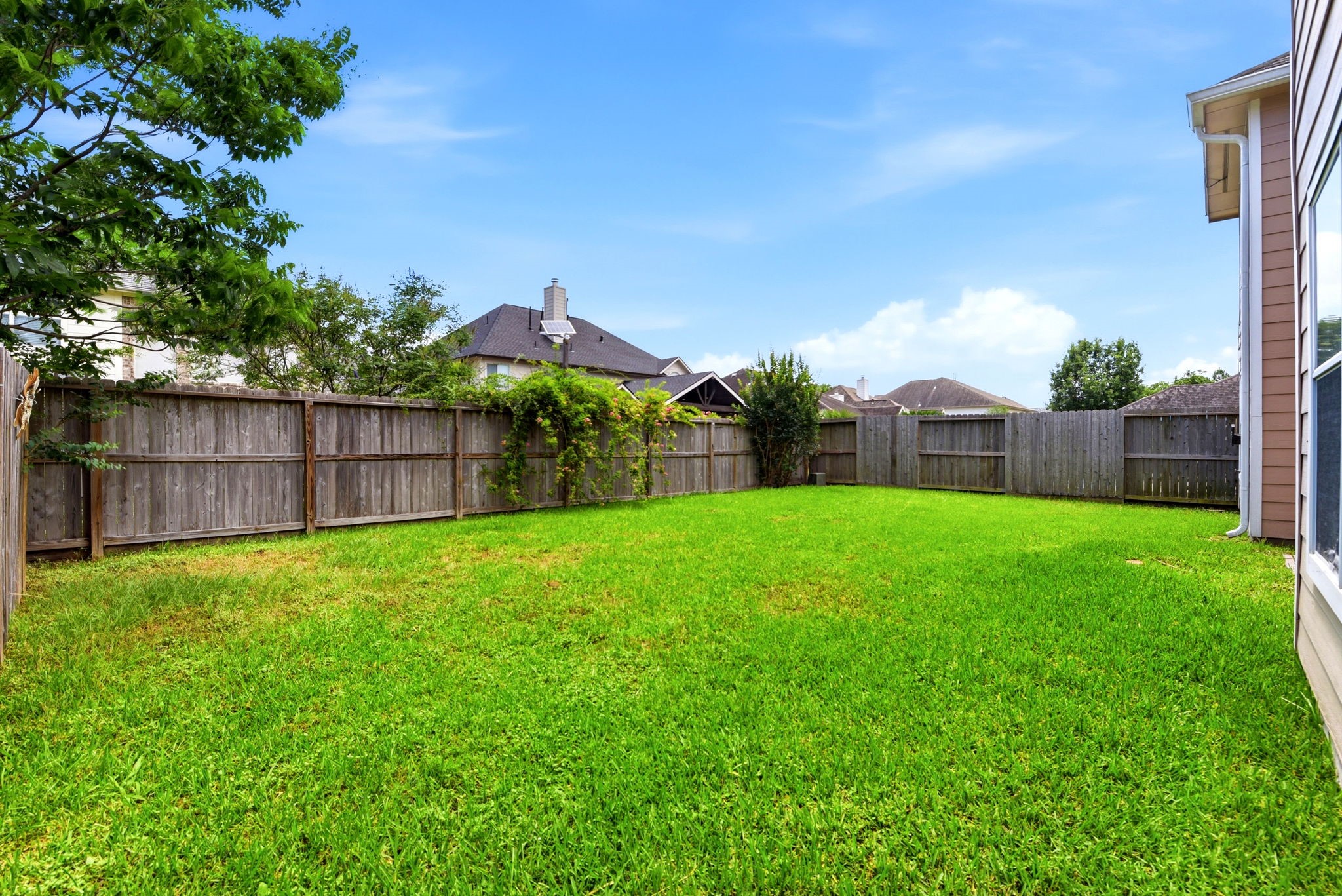 22102 Bridgestone Crossing Drive Spring, TX 77388 - Photo 36 of 38 a view of a yard with a large tree and a fence