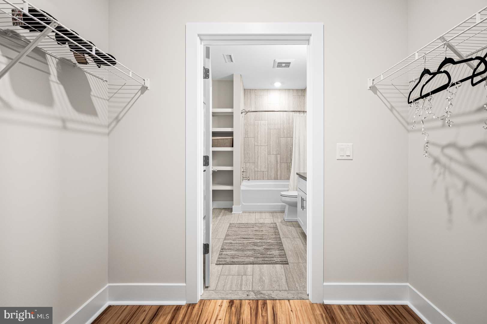 703 Rice Boulevard, Unit 103 Exton, PA 19341 - Photo 9 of 10 Stylish entry to a modern bathroom.