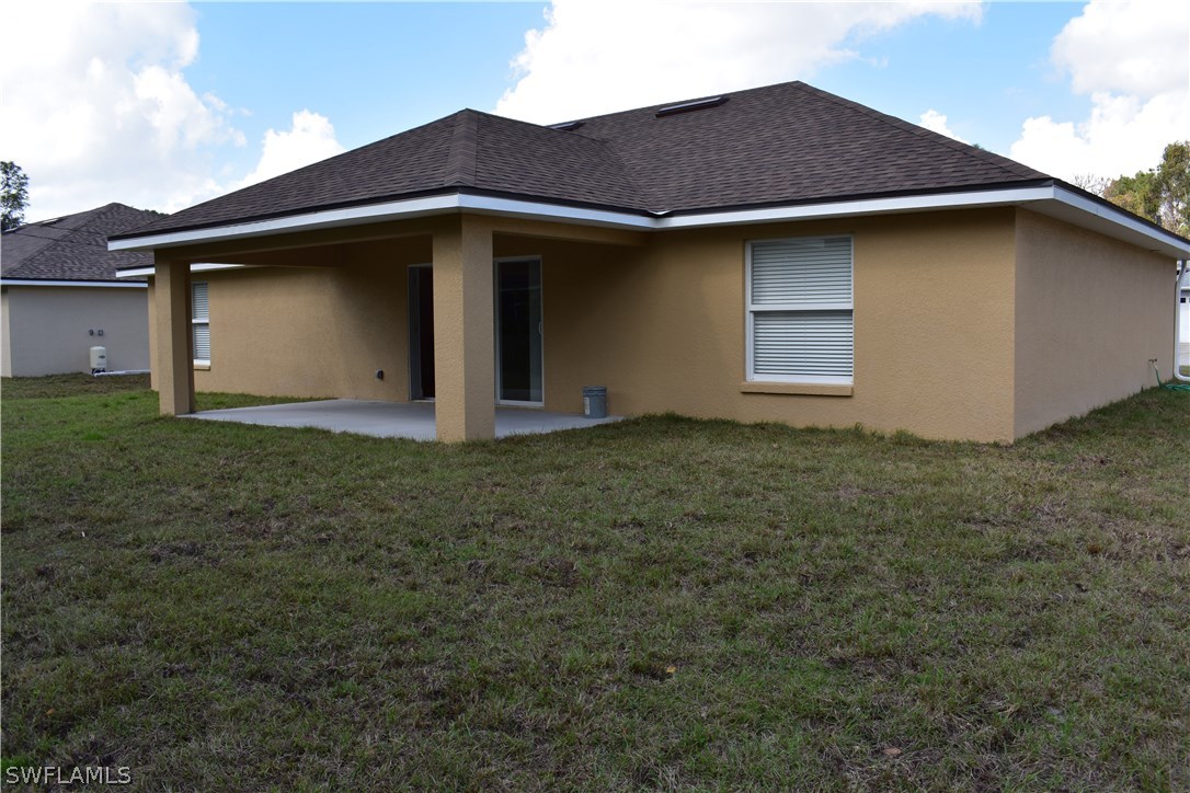 8152 Anhinga Road Fort Myers, FL 33967 - Photo 13 of 19 a house with yard in front of it