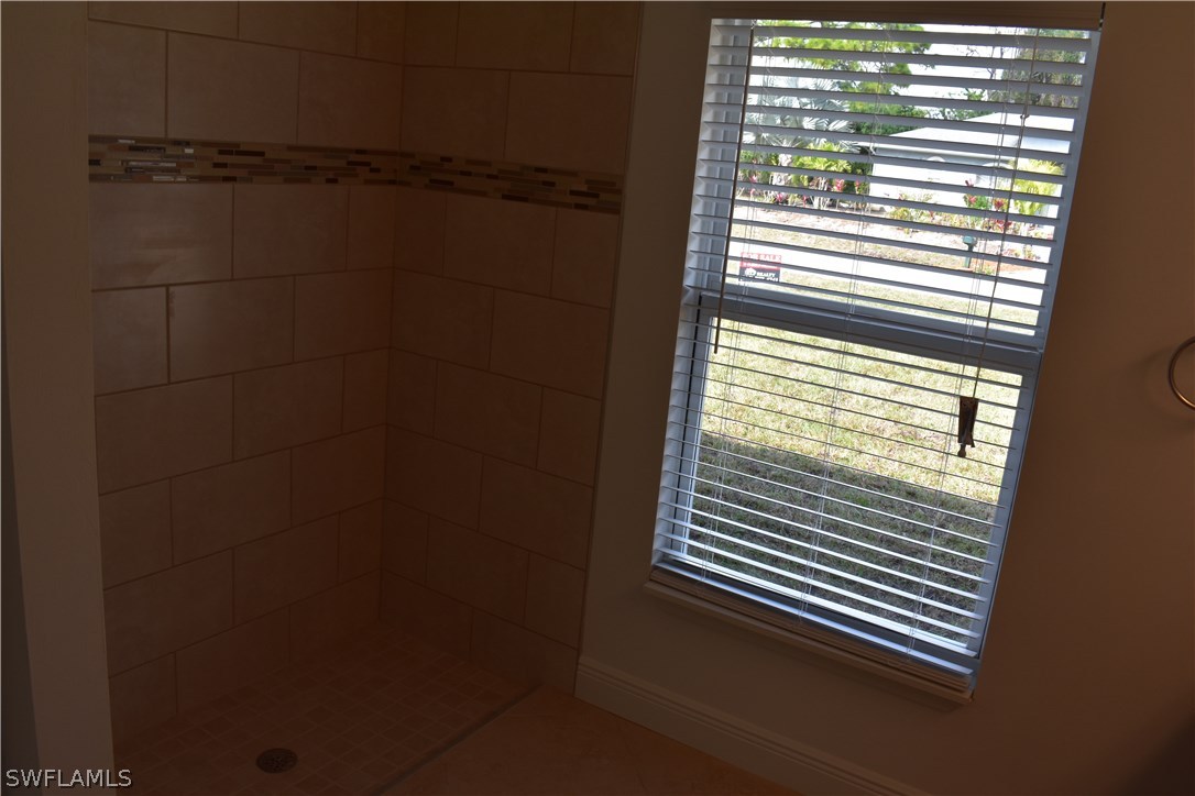 8152 Anhinga Road Fort Myers, FL 33967 - Photo 4 of 19 a view of a bathroom with a window