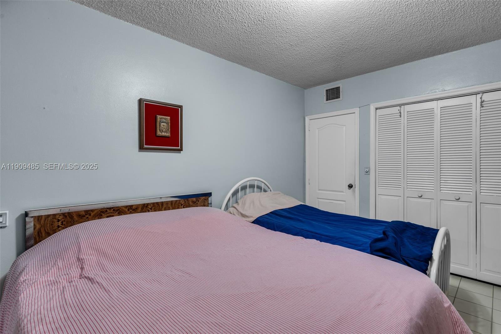5834 Southwest 4th Street Miami, FL 33144 - Photo 14 of 33 a bedroom with a bed and a window
