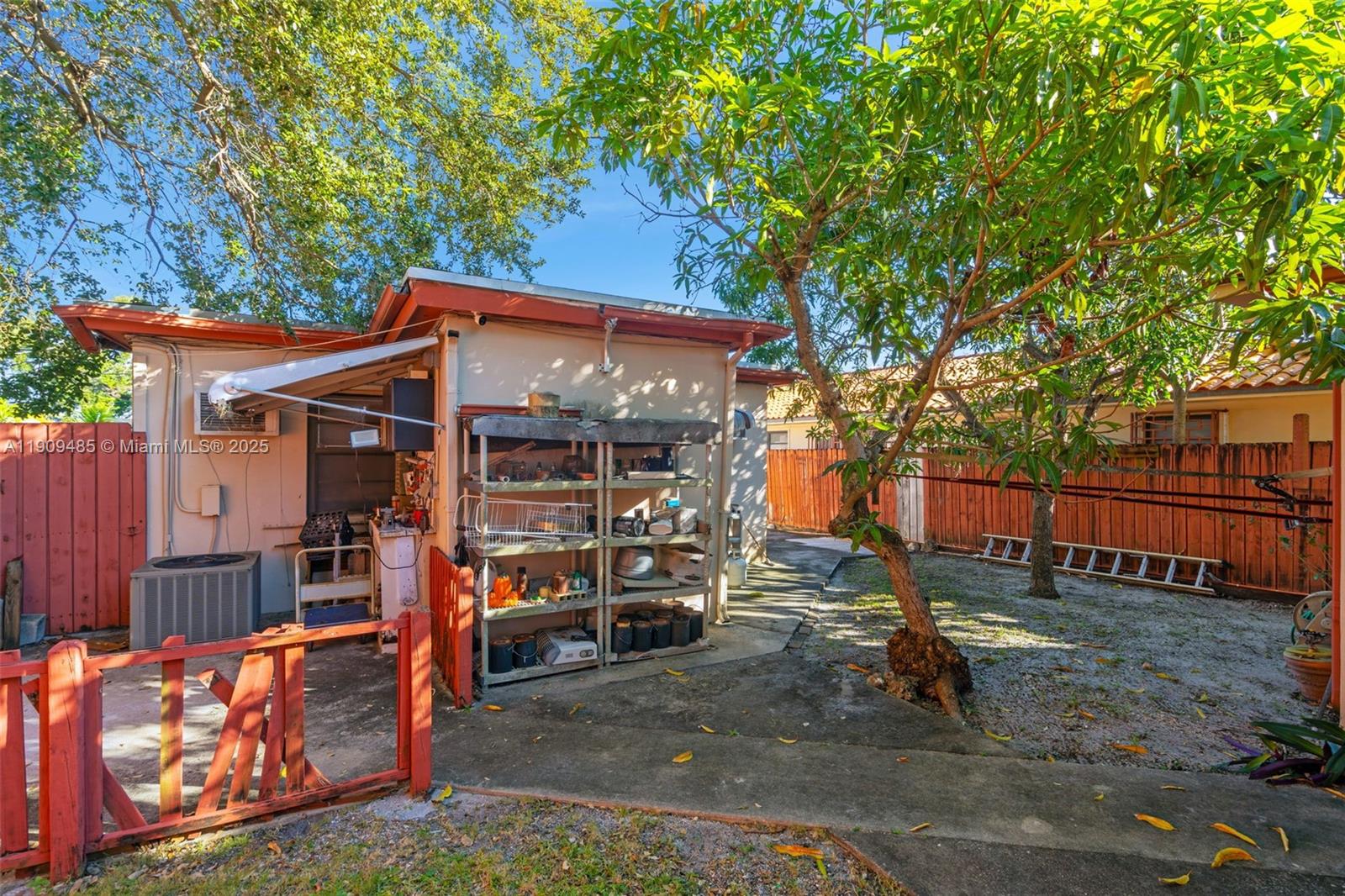 5834 Southwest 4th Street Miami, FL 33144 - Photo 23 of 33 front view of a house with a large tree