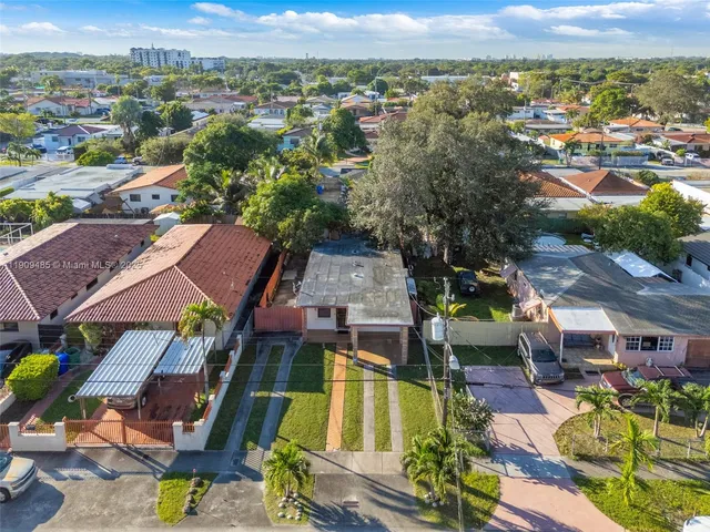 an aerial view of a house with a ocean view