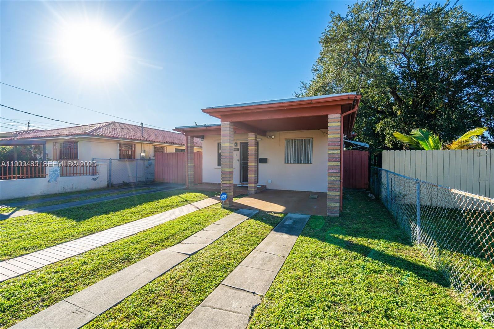 5834 Southwest 4th Street Miami, FL 33144 - Photo 4 of 33 a view of house with backyard and outdoor seating