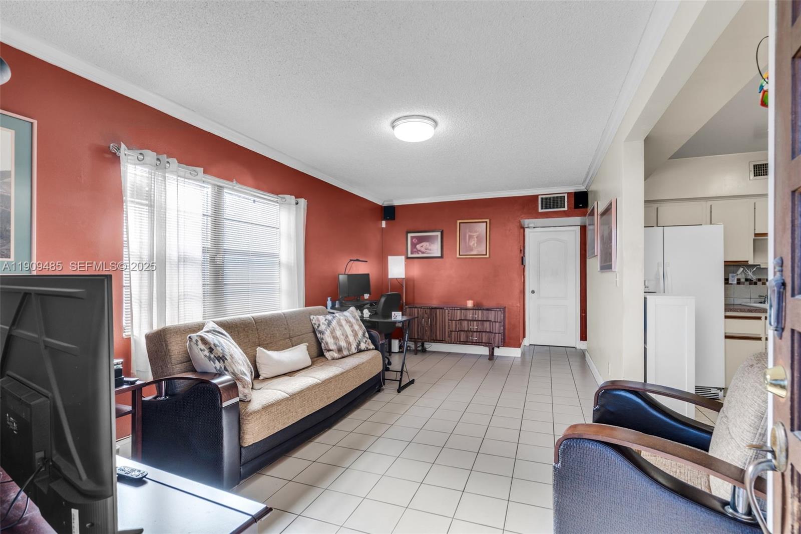 5834 Southwest 4th Street Miami, FL 33144 - Photo 6 of 33 a living room with furniture and a large window