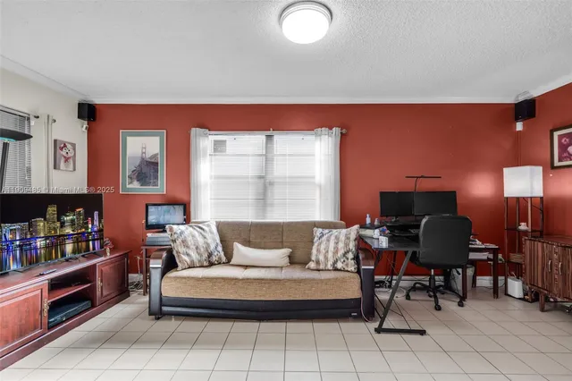 a living room with furniture and a piano