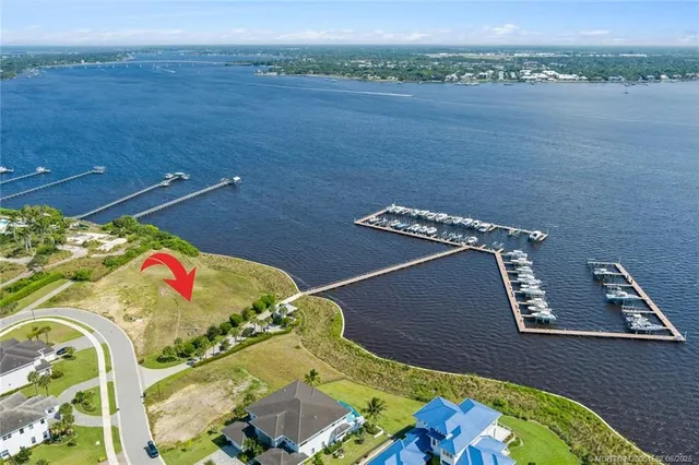 an aerial view of a house a yard swimming pool and outdoor seating