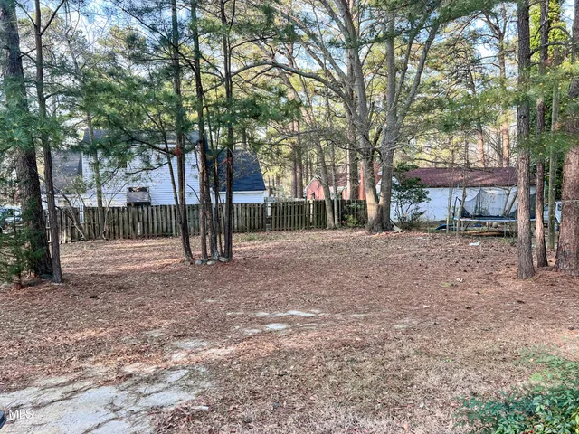 a view of road with trees in front of it