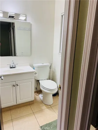 a bedroom with bed and window