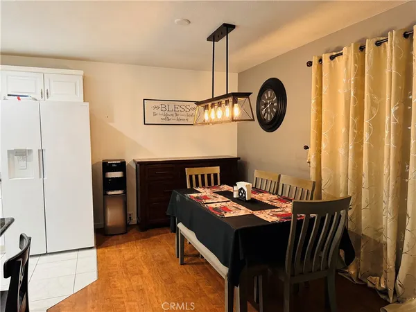 a view of a dining area with furniture and a large window