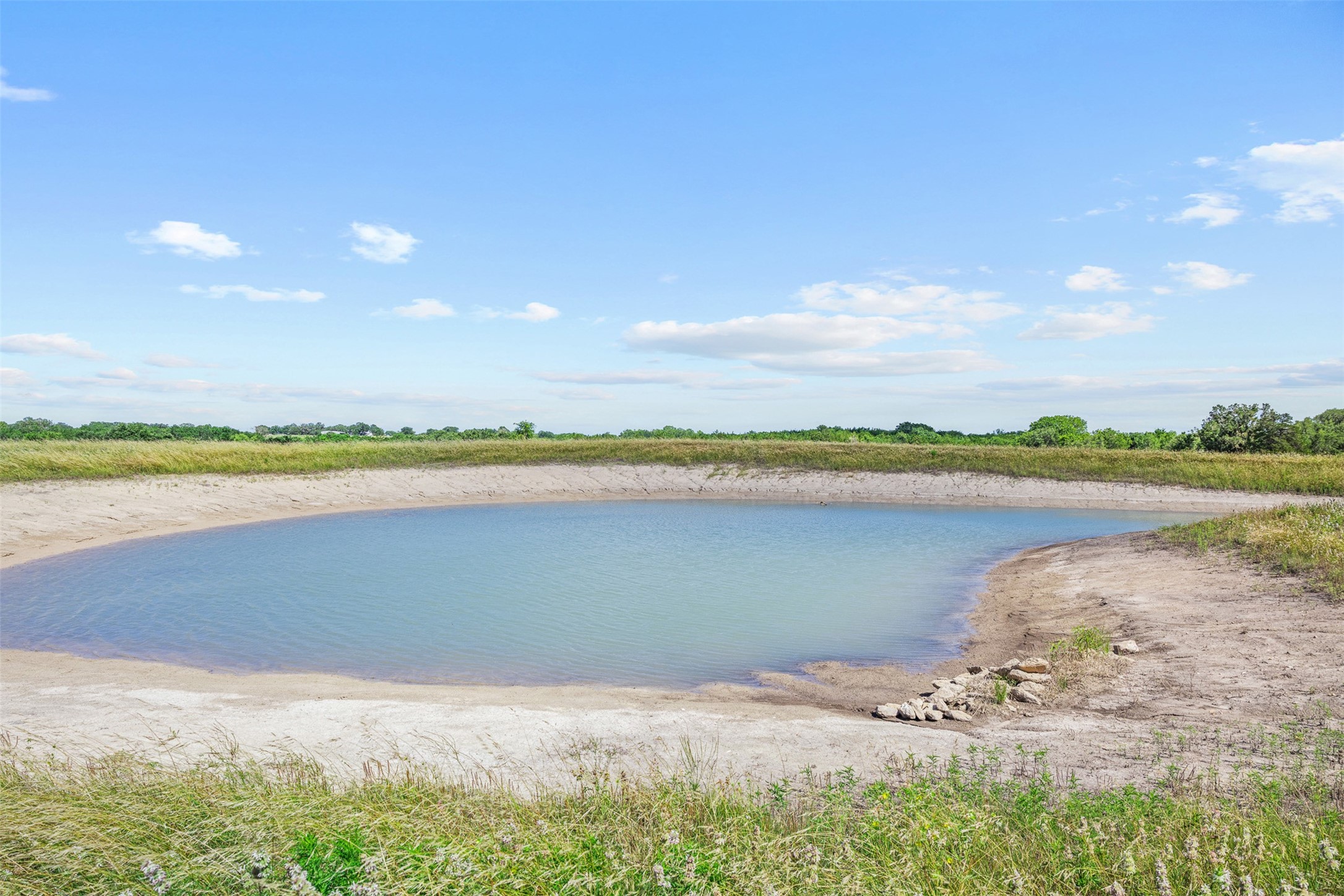 1291 West Tract 5 Round Top, TX 78954 - Photo 2 of 8 a view of a lake with a beach