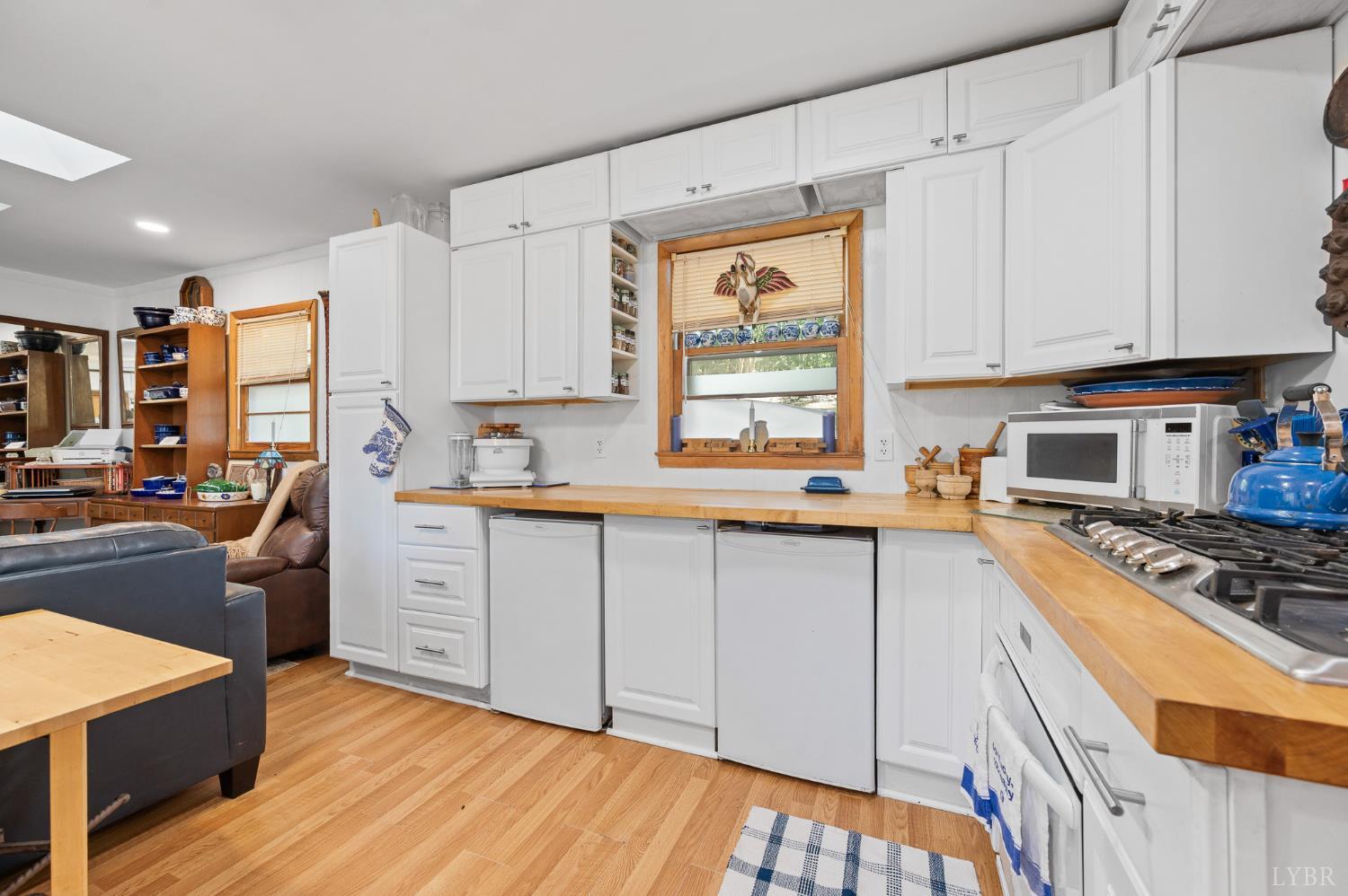 1451 Trellis Ridge Drive Lynch Station, VA 24571 - Photo 11 of 42 a kitchen with stainless steel appliances a stove sink and cabinets