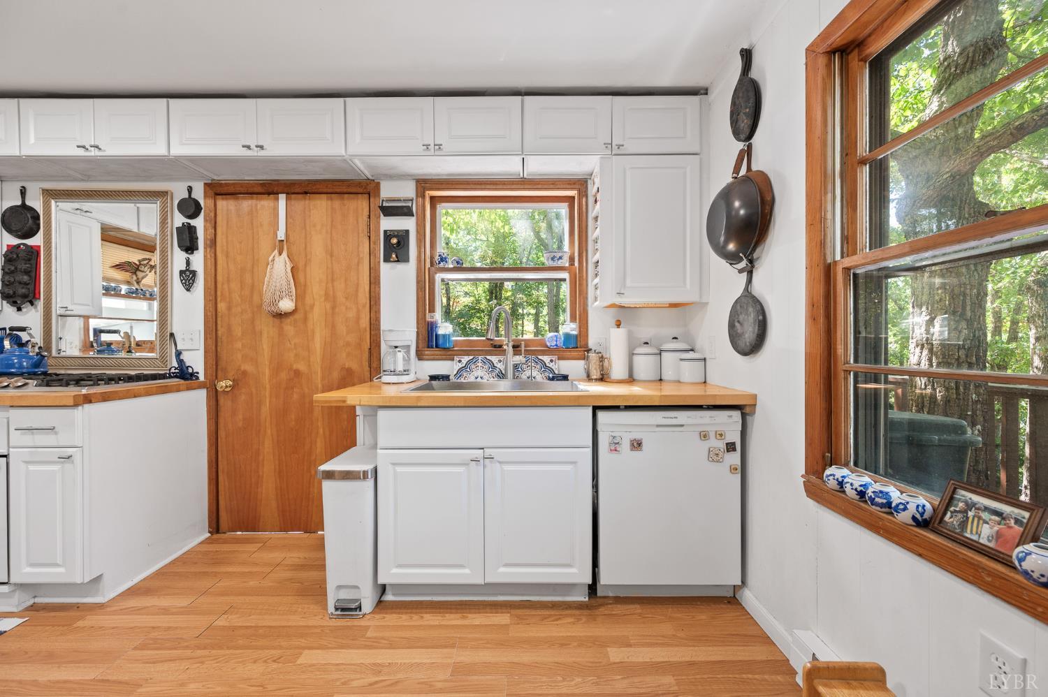 1451 Trellis Ridge Drive Lynch Station, VA 24571 - Photo 12 of 42 a kitchen with a sink window and cabinets