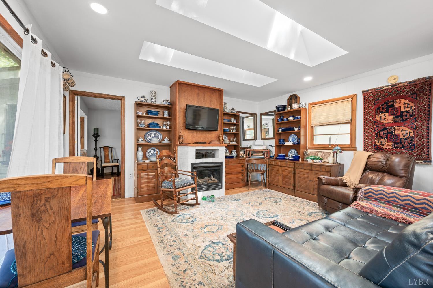 1451 Trellis Ridge Drive Lynch Station, VA 24571 - Photo 13 of 42 a living room with lots of furniture and kitchen view