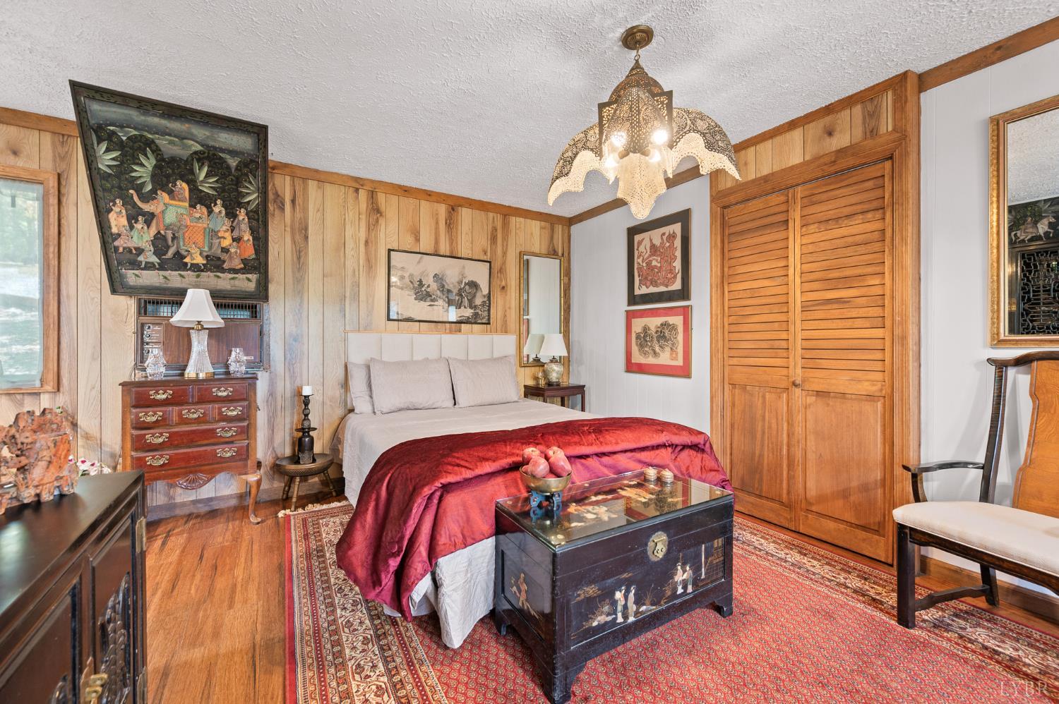 1451 Trellis Ridge Drive Lynch Station, VA 24571 - Photo 18 of 42 a spacious bedroom with a bed and a chandelier