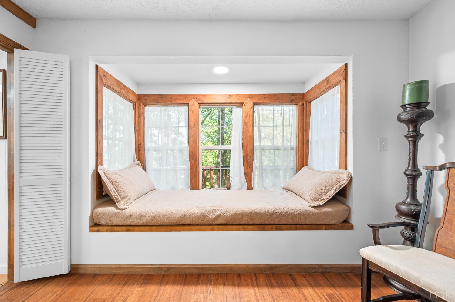 1451 Trellis Ridge Drive Lynch Station, VA 24571 - Photo 19 of 42 a living room with furniture and a large window